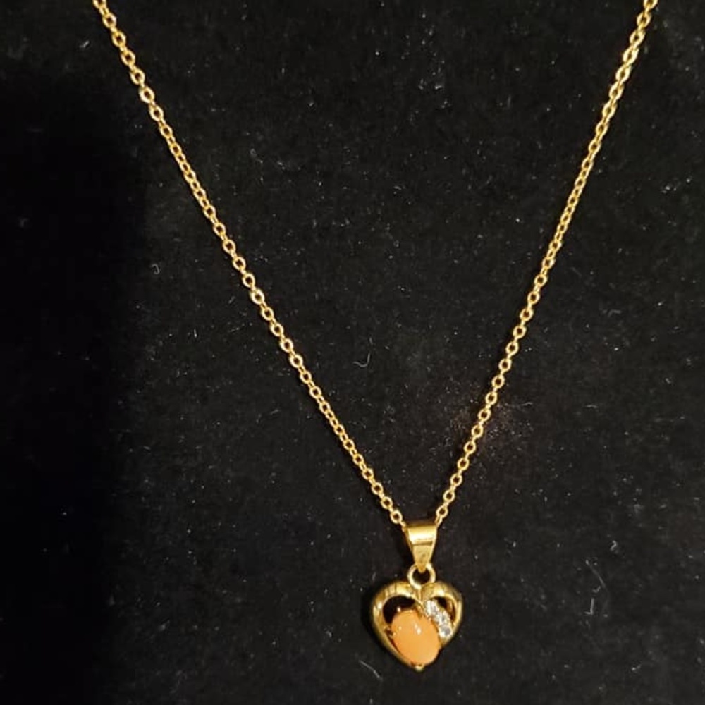 Coral, rhinestone and gold tone heart necklace